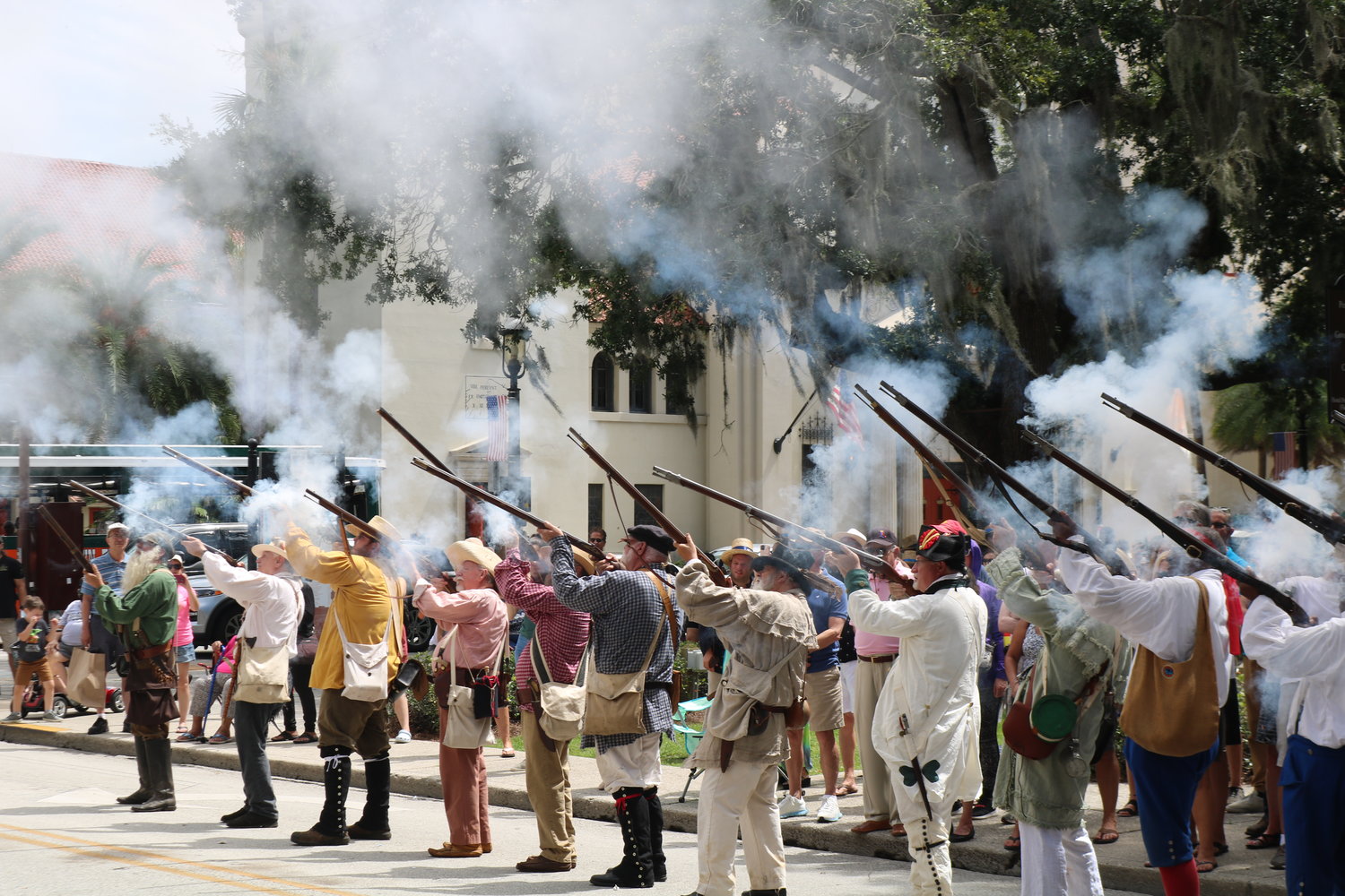 Reenactors fire muskets following the signing of the Adams-Onis treaty.